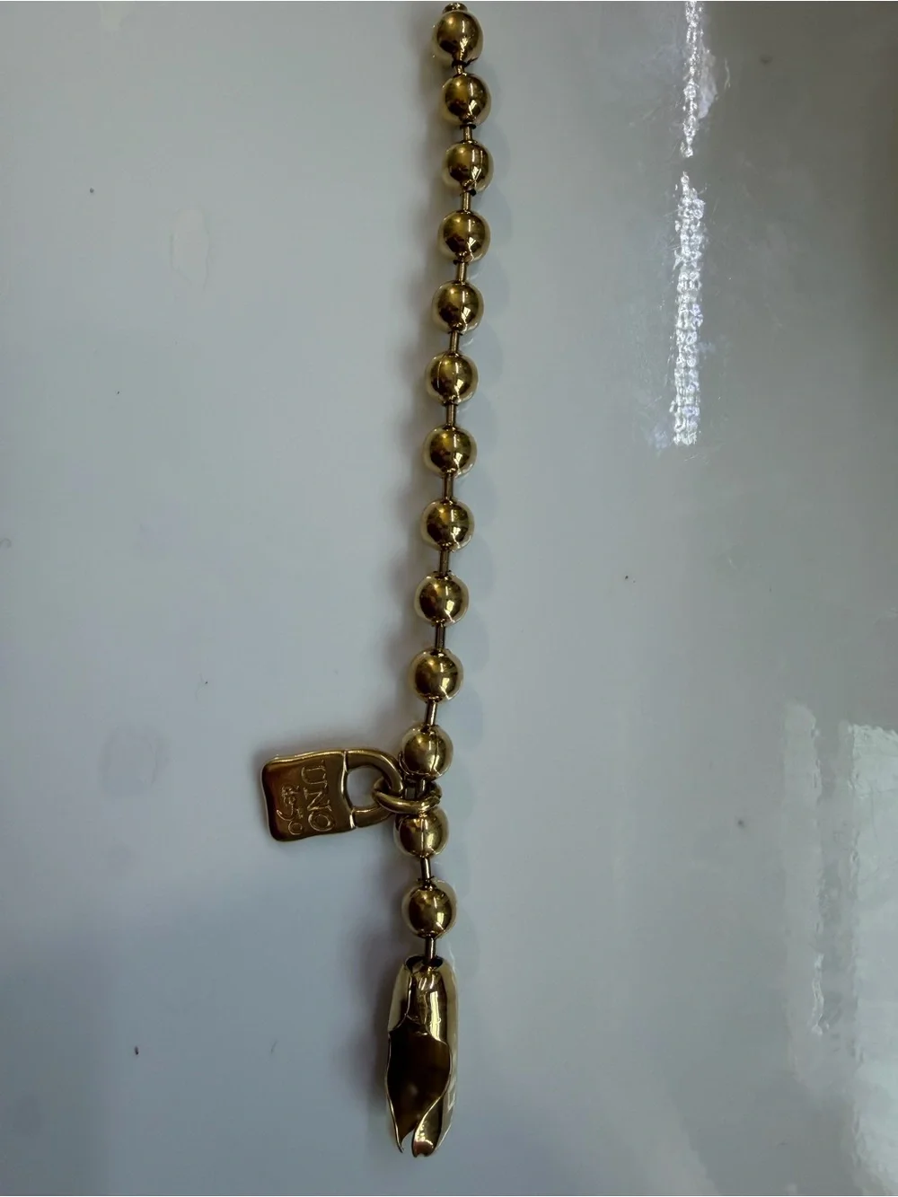 UNO de 50 Gold-Tone Beaded Bracelet with Padlock Charm